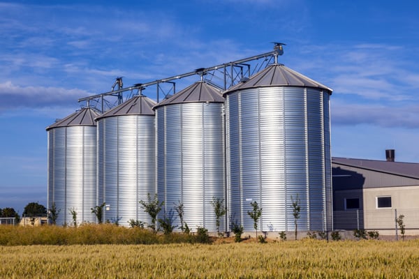 Farm Silos Against Blue Sky