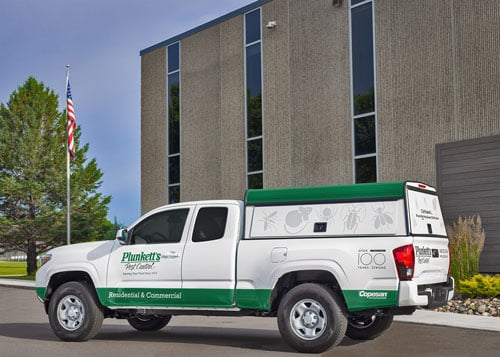 Plunketts Pest Control Vehicle In Commercial Lot